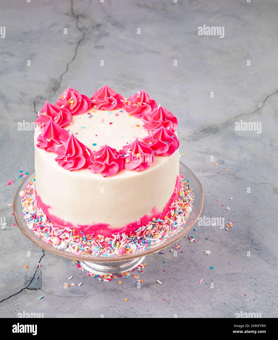 Pink Birthday Cake with buttercream icing and sprinkles Stock Photo Alamy