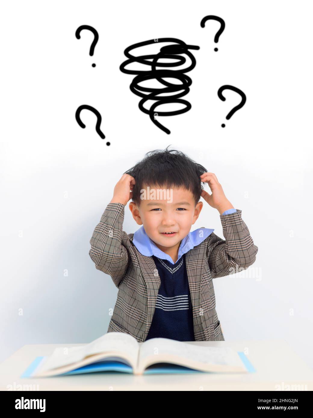 Confused kid  doing homework and study at home Stock Photo
