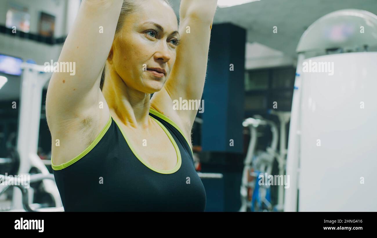 Fit Athletic Woman Exercises with Dumbbell. Muscular Women Training in
