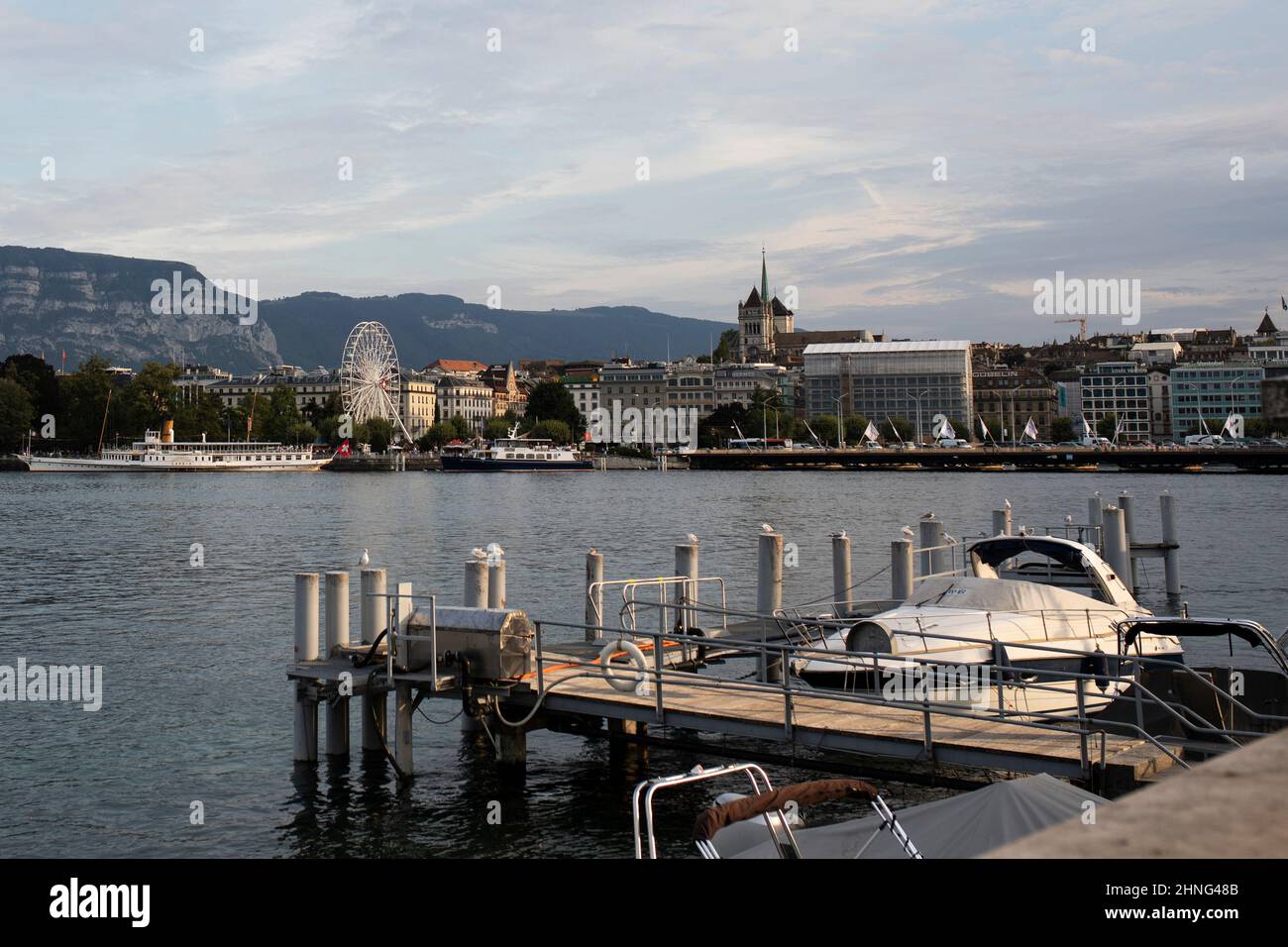 Looking across Lake Geneva (Lac Leman) toward the Jardin Anglais, Prom du Lac, and Pont du Mont-Blanc on a summer day in Geneva, Switzerland. Stock Photo
