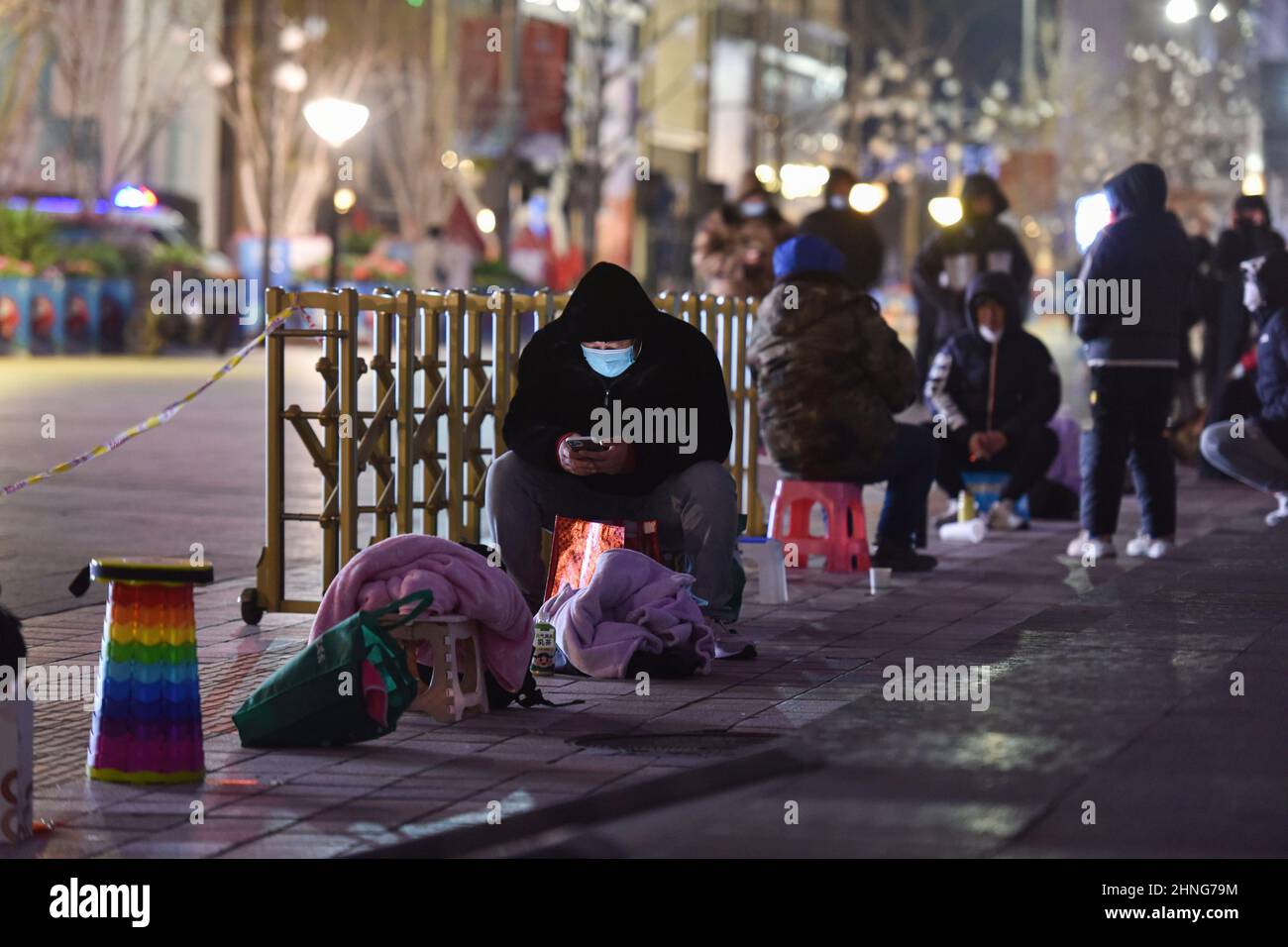 Beijing, China. 12th Feb, 2022. Customers lining up before dawn to buy Bing Dwen Dwen. Every day since the opening of the Beijing Winter Olympics, people have lined up outside the licensed store on Beijing's Wangfujing Street to buy toys featuring the games' mascot, Bing Dwen Dwen, which have become a sought-after item in China. (Photo by Sheldon Cooper/SOPA Images/Sipa USA) Credit: Sipa USA/Alamy Live News Stock Photo