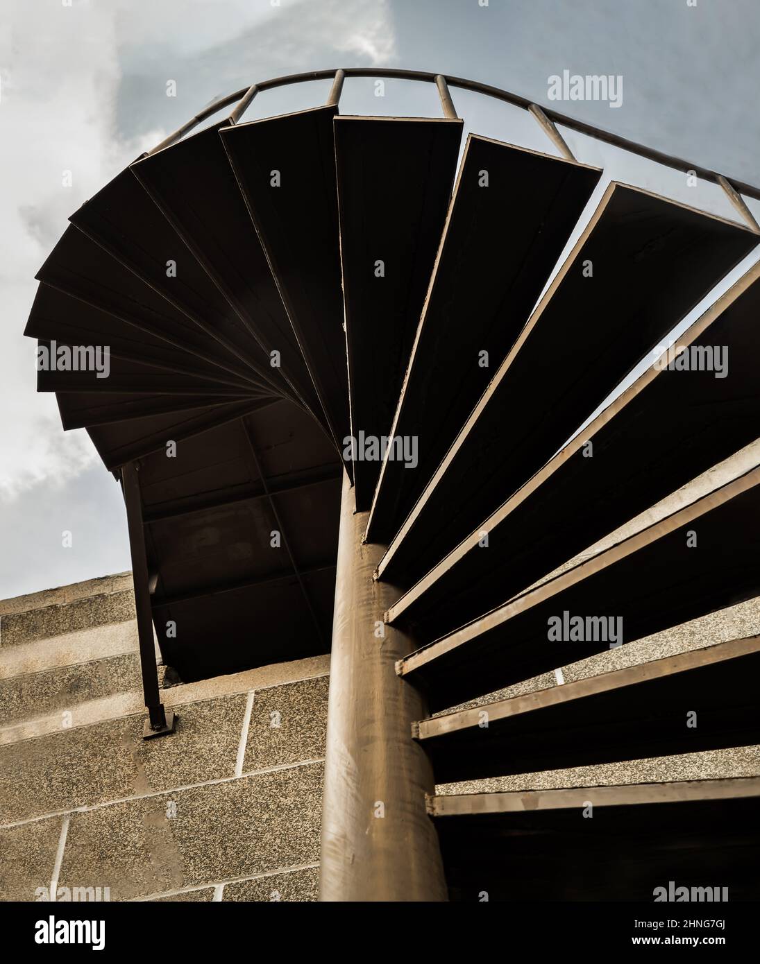 Below view of Brown metal spiral staircase pattern with iron railing in ...