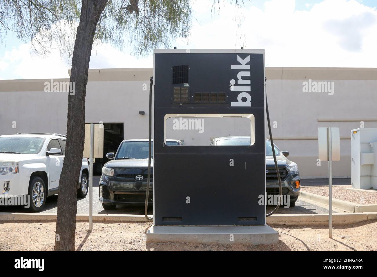 A Blink charging station is located at a Carvana car dealer in Mesa