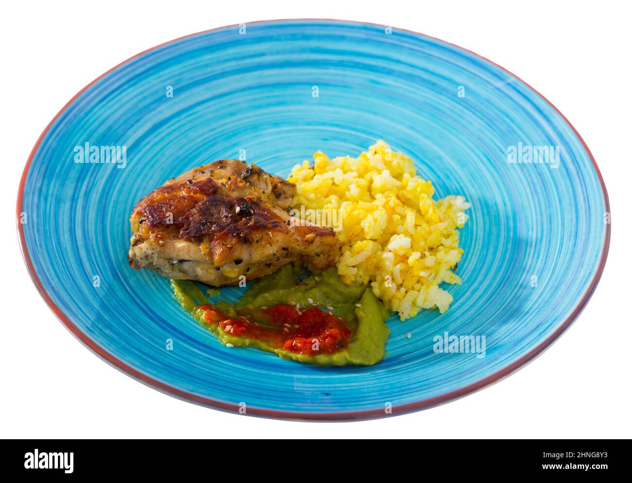 Fried chicken thighs with yellow rice and sauces Stock Photo Alamy