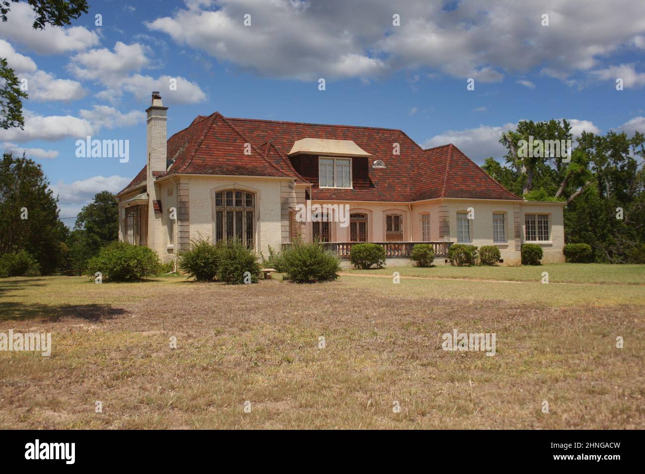 Abandoned Historic Brick House With Blue Sky and Clouds Stock Photo - Alamy
