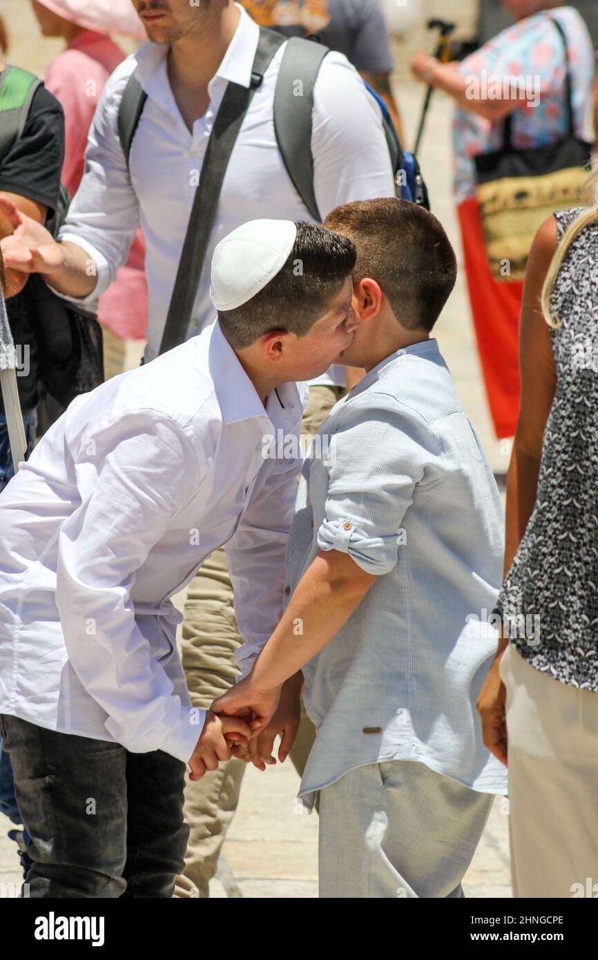 Two brothers greet one another in Jerusalem, Israel. Stock Photo