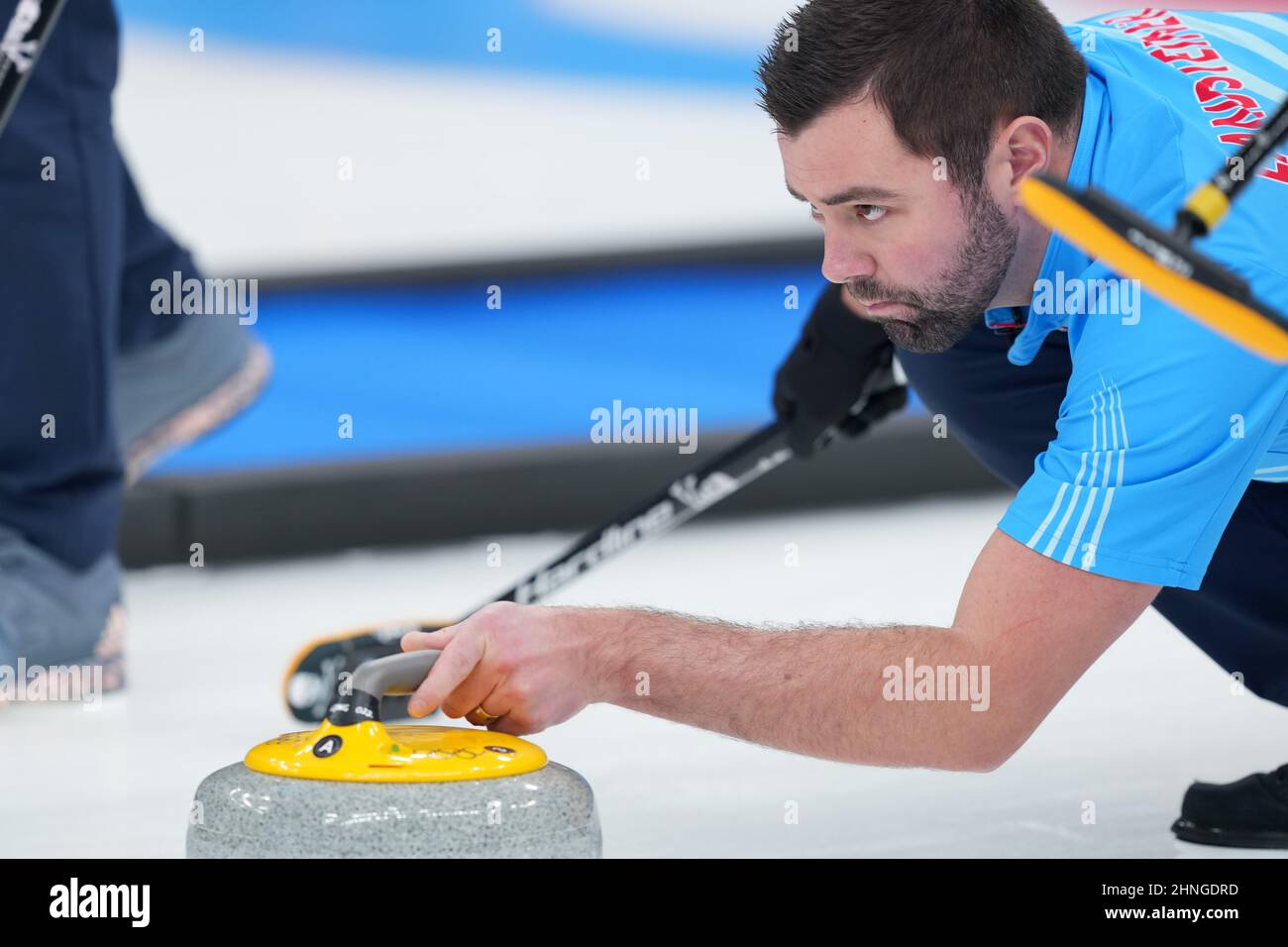 Beijing, China. 17th Feb, 2022. John Landsteiner of the United States competes during the curling men's round robin session 12 of Beijing 2022 Winter Olympics between the United States and Denmark at National Aquatics Centre in Beijing, capital of China, Feb. 17, 2022. Credit: Zhou Mi/Xinhua/Alamy Live News Stock Photo