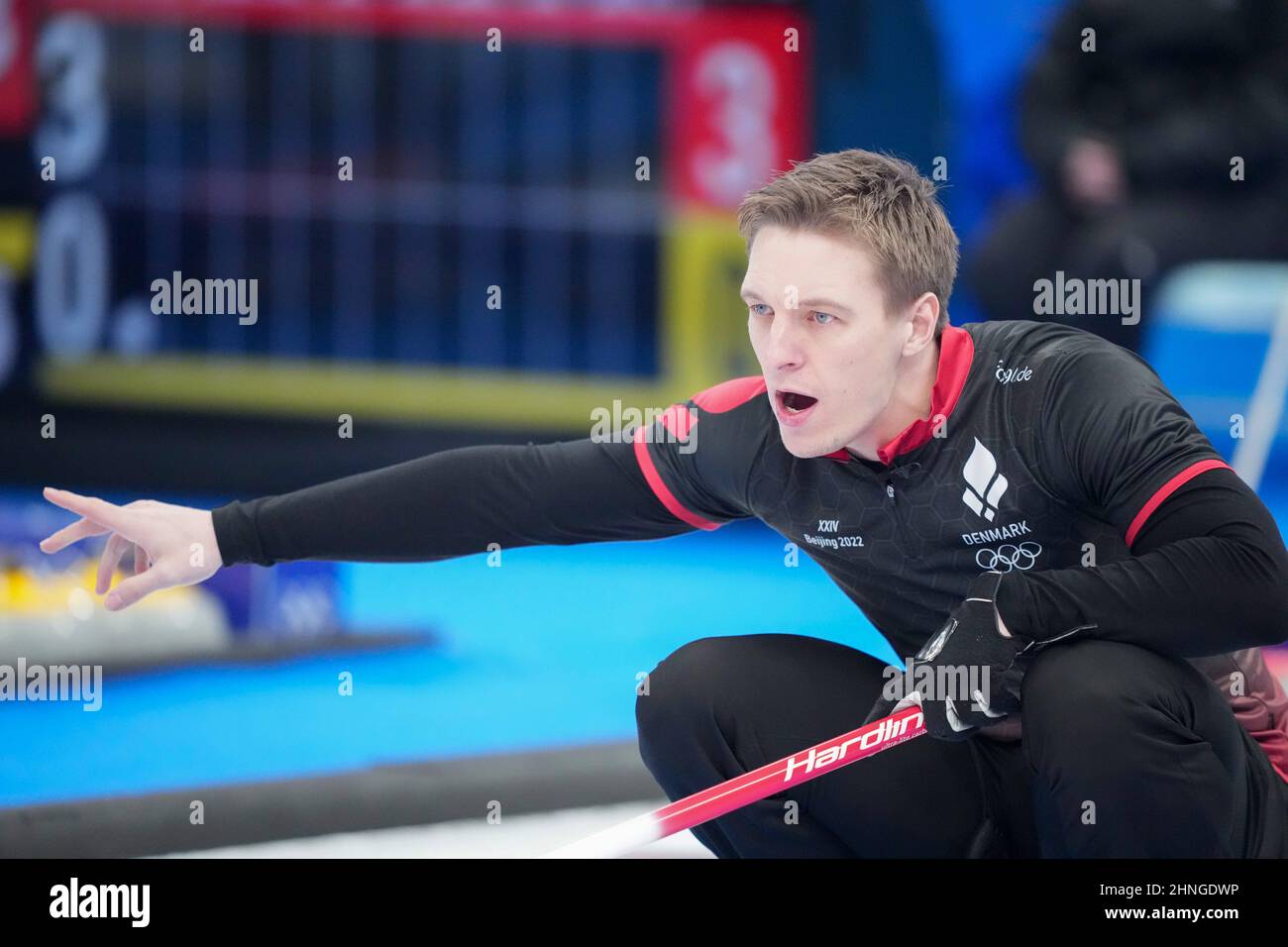 Beijing, China. 17th Feb, 2022. Mikkel Krause (R) of Denmark competes during the curling men's round robin session 12 of Beijing 2022 Winter Olympics between the United States and Denmark at National Aquatics Centre in Beijing, capital of China, Feb. 17, 2022. Credit: Zhou Mi/Xinhua/Alamy Live News Stock Photo