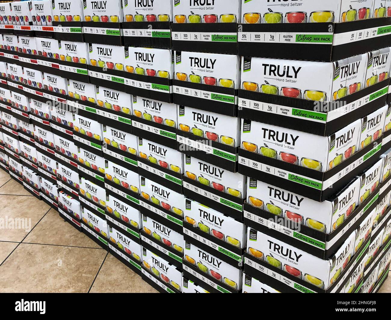 NEW BRAUNFELS, TX - 22 FEB 2020: Truly brand Hard Seltzer alcohol citric mix pack on display in stacks of boxes, for sale in a retail store. Stock Photo