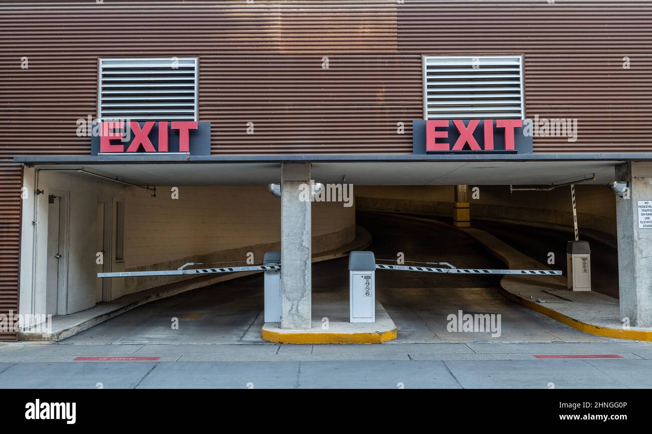 Two Parking Garage Ramp Exits with Red Exit Signs over doorways where