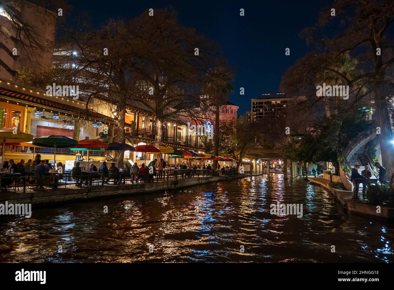 SAN ANTONIO, TX - 23 JAN 2020: The riverwalk at night with people enjoying themselves along the river. Stock Photo