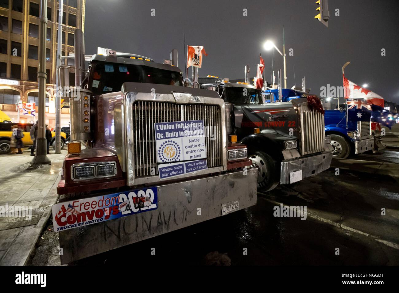 Ottawa, Canada. 16 Feb 2022. On the evening of the 20th day of the occupation of downtown Ottawa by protests a trio of trucks block Sussex Drive at Rideau Street.  Credit: Sean Burges / Stock Photo