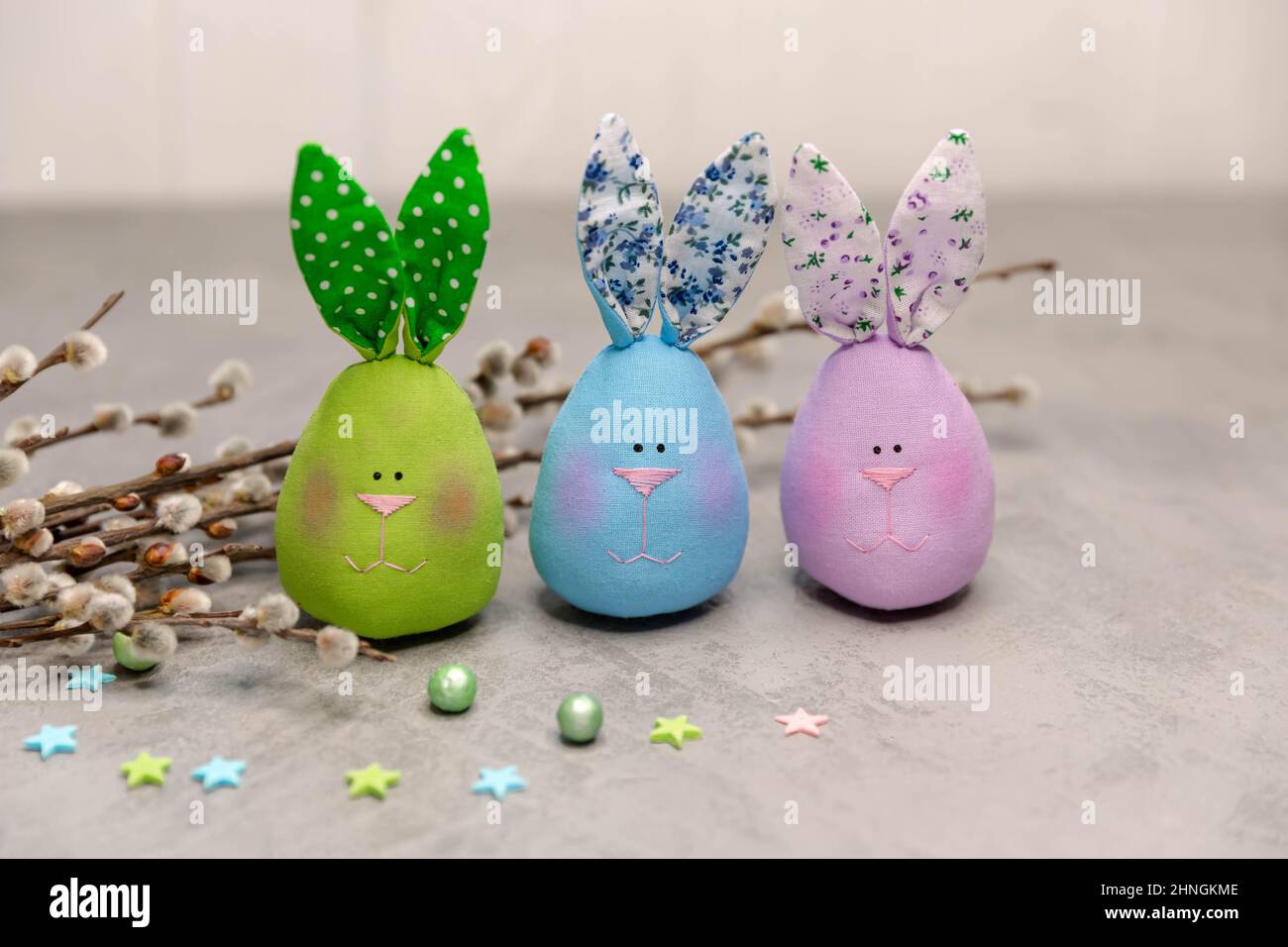 Seamless textile cute colourful rabbits on grey background. Stock Photo