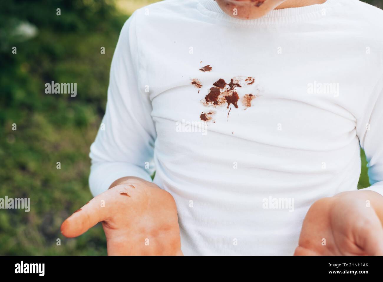Chocolate stains on white clothes. outdoors. daily life dirty stain for wash and clean concept Stock Photo
