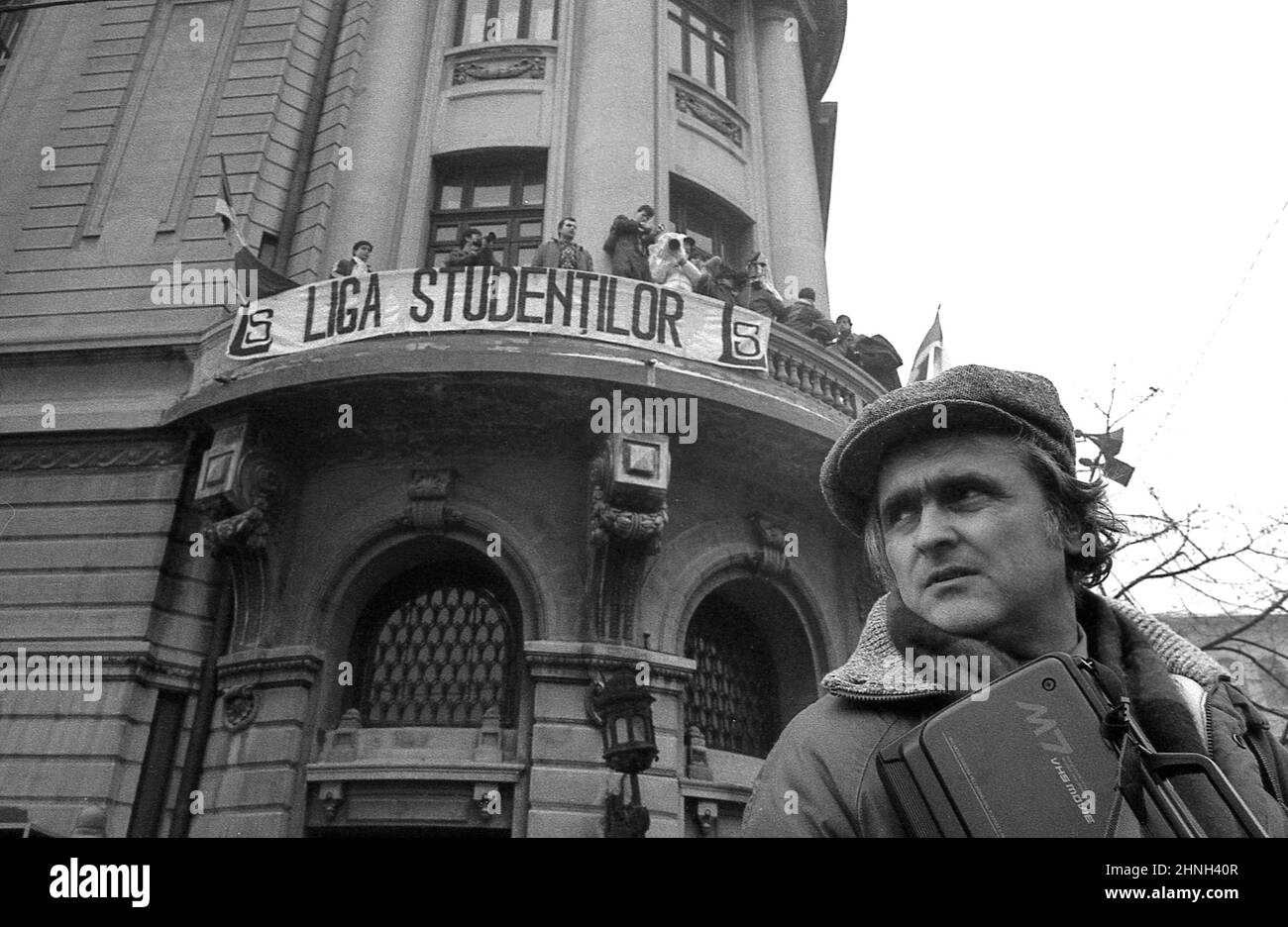 Bucharest, Romania, April 1990. Journalist Ion Longin Popescu in front of the famous balcony of the University building, during 'Golaniada', a major anti-communism protest in Piata Universitatii, following the Romanian Revolution of 1989. Stock Photo