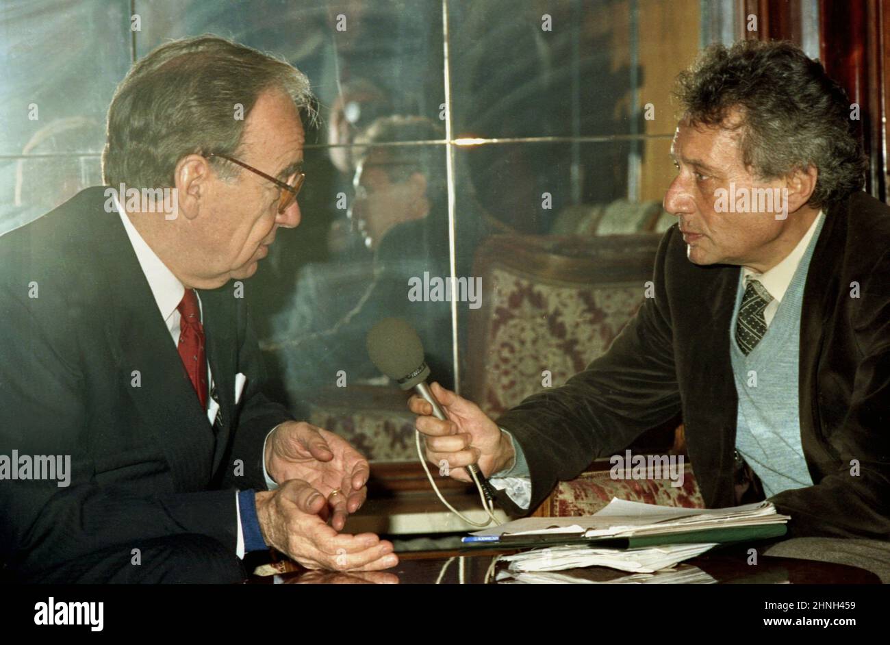 Bucharest, Romania, 1990. Australian- American business magnate Rupert Murdoch being interviewed by journalist Alexandru Stark (right), soon after the fall of communism. Stock Photo