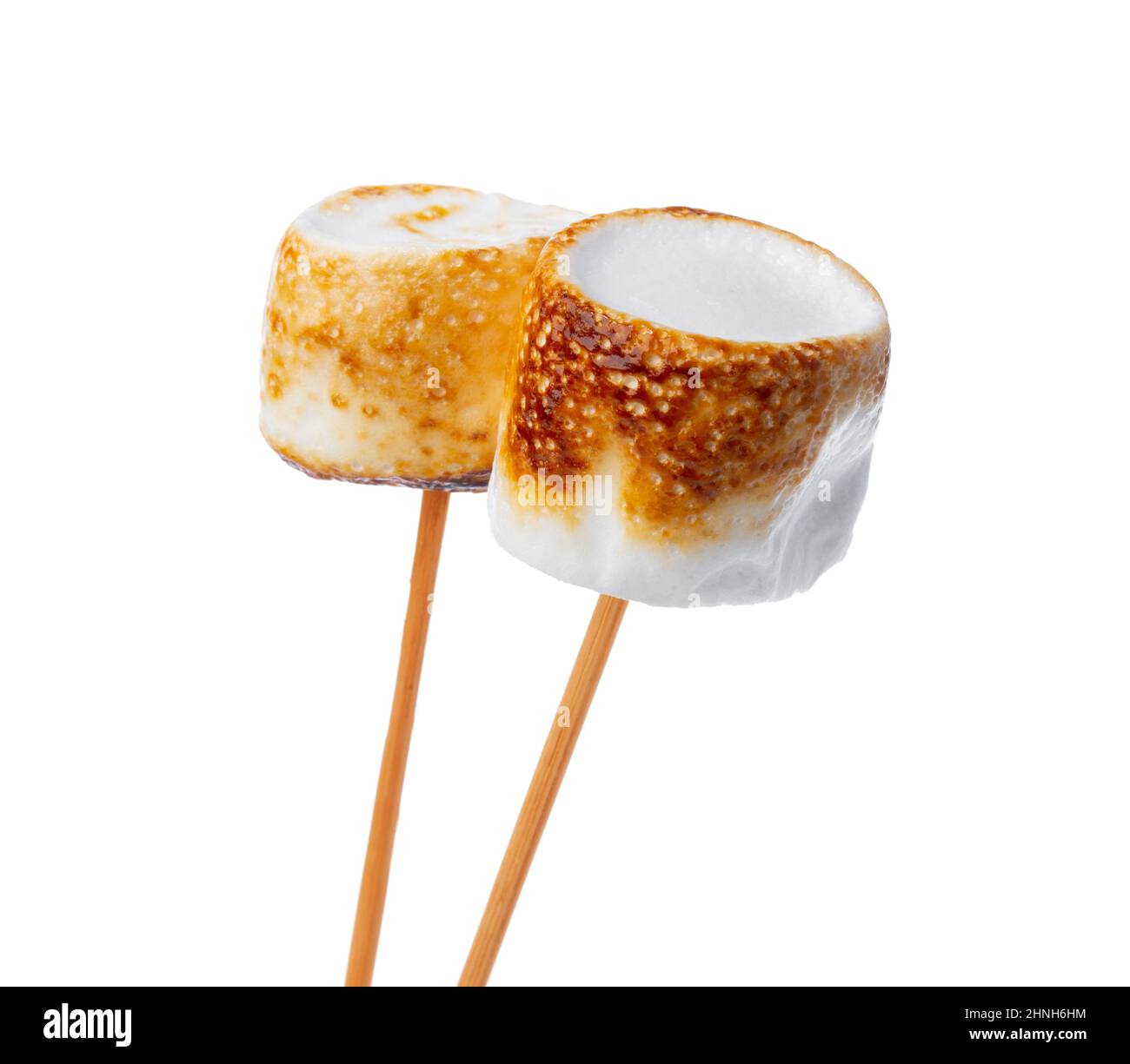 Grilled marshmallows on sticks isolated on white Stock Photo Alamy