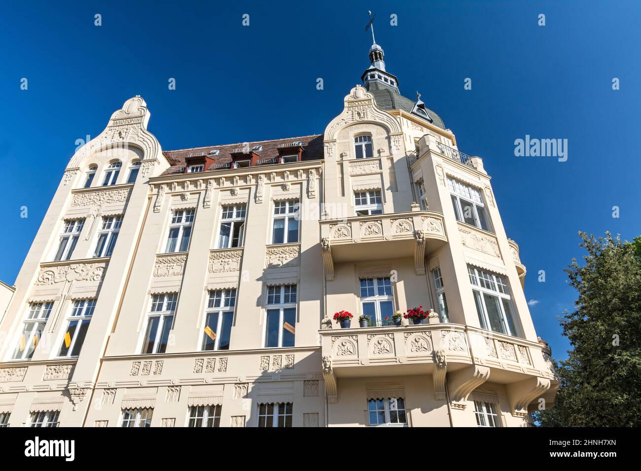 Facade of beautiful historic apartment building under blue skies Stock Photo