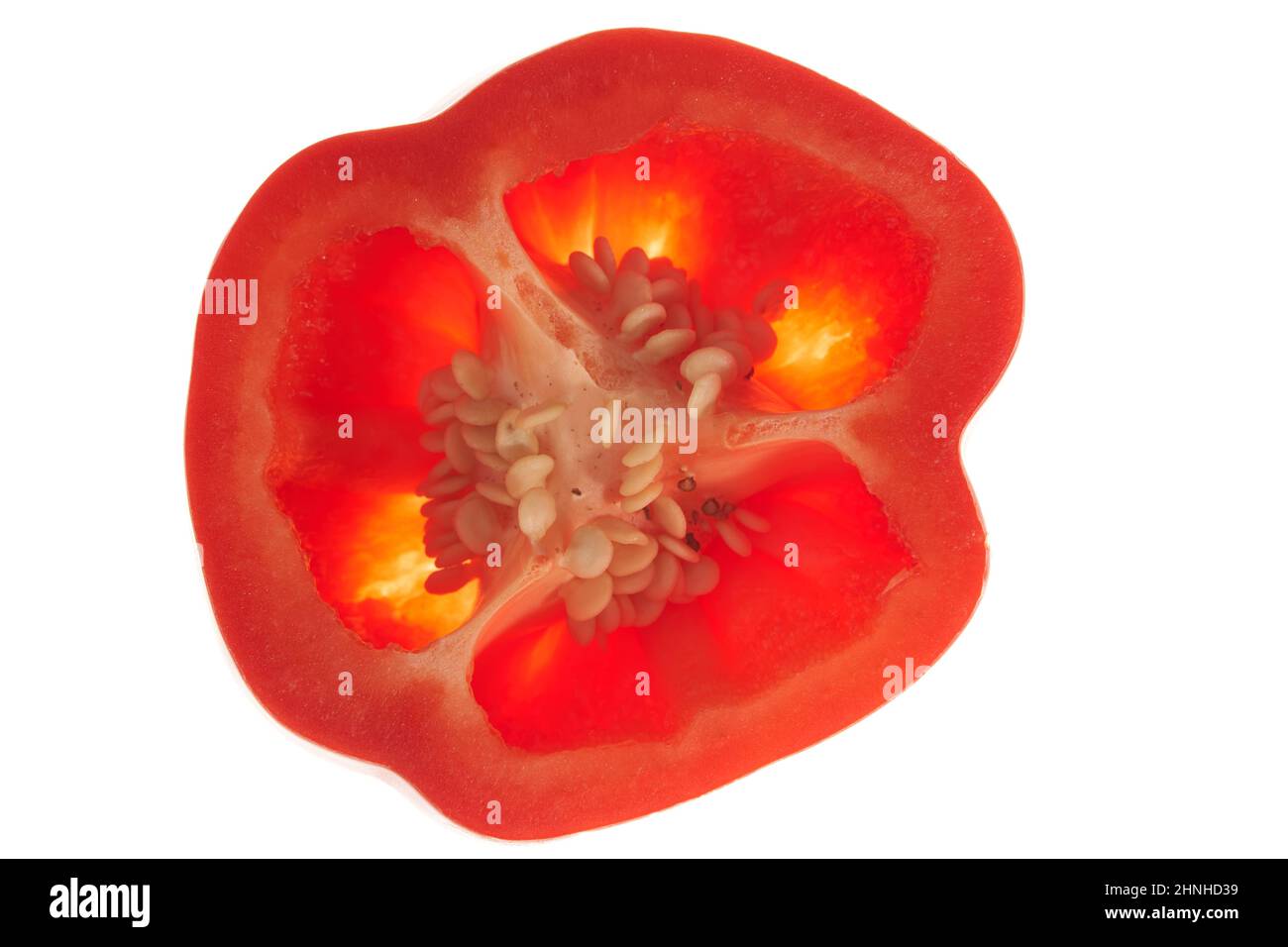 Close-up of a piece of sweet red bell pepper with seeds inside. Isolated on a white background.A piece of red pepper halves. High quality photo Stock Photo