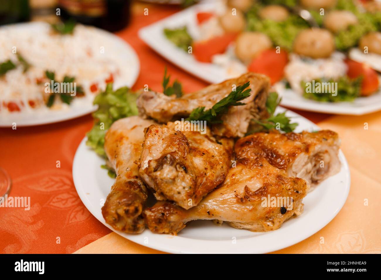 Plate with roasted chicken on holiday table Stock Photo