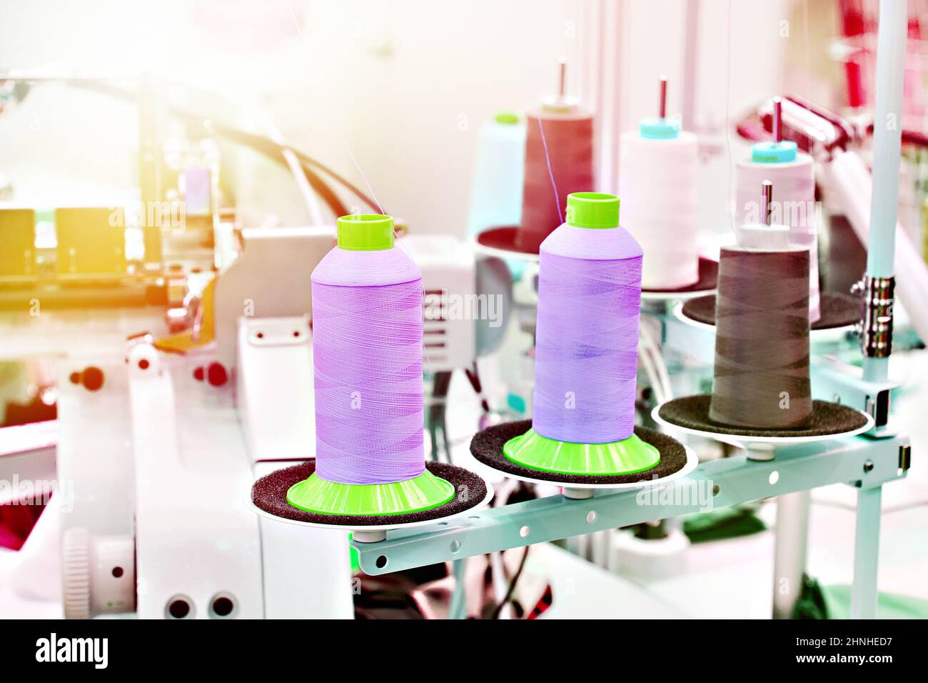 Sewing with threads and electric sewing machines Stock Photo