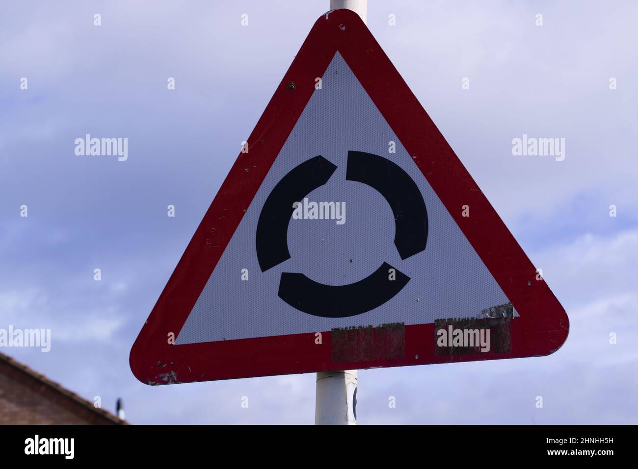 Close-up of a Roundabout / Road Traffic Sign Stock Photo - Alamy