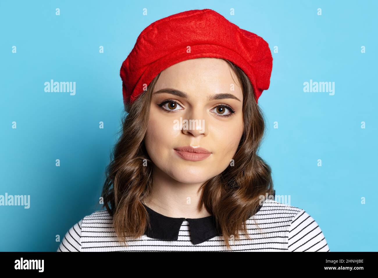 Halflength portrait of young charming girl with long curly hair