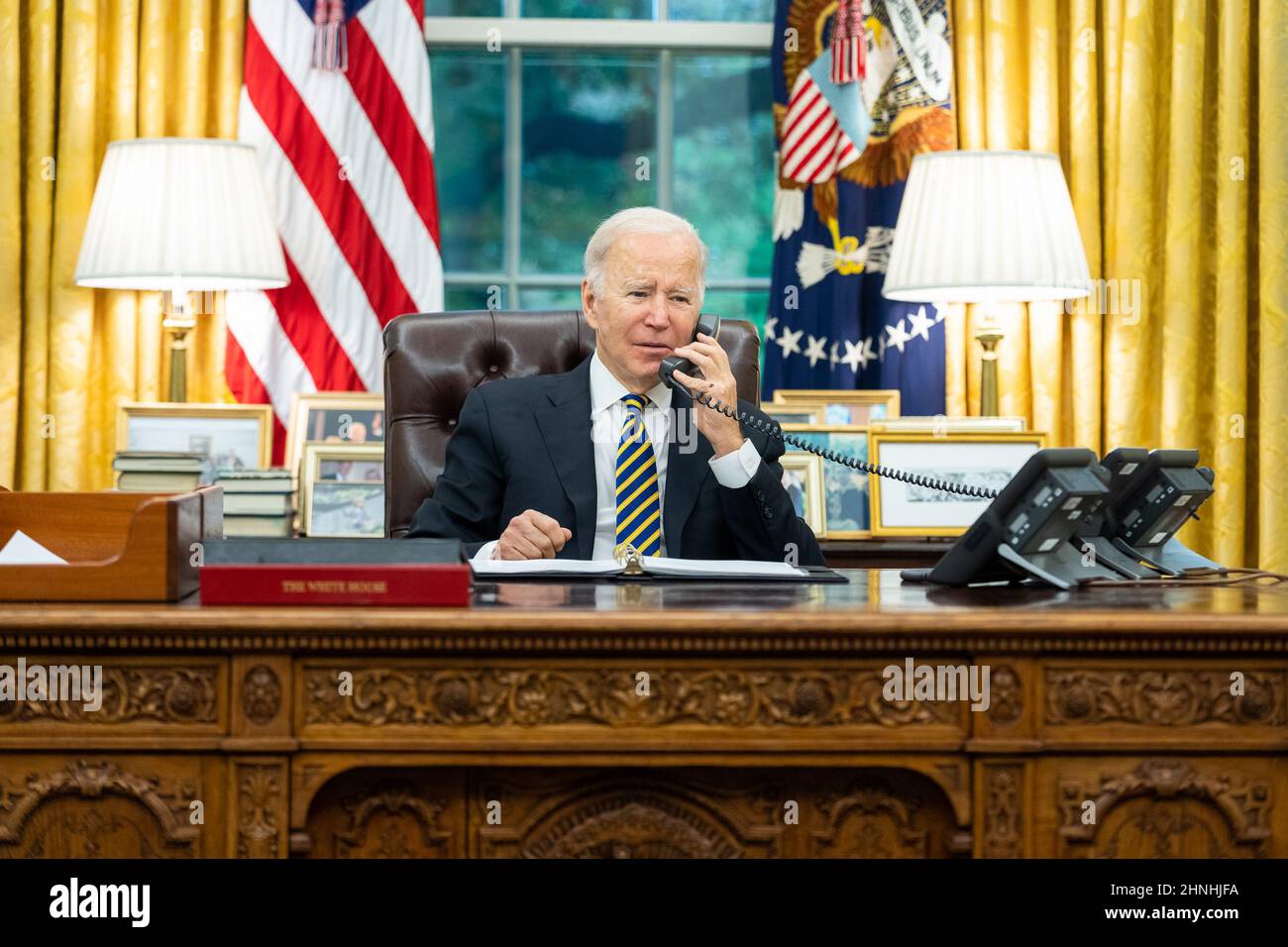 Washington, District of Columbia, USA. 12th Nov, 2021. President Joe Biden talks on the phone with Sen. Patrick Leahy, D-Vt., Friday, November 12, 2021, in the Oval Office of the White House. (Photo by Adam Schultz) Credit: White House/ZUMA Press Wire Service/ZUMAPRESS.com/Alamy Live News Stock Photo