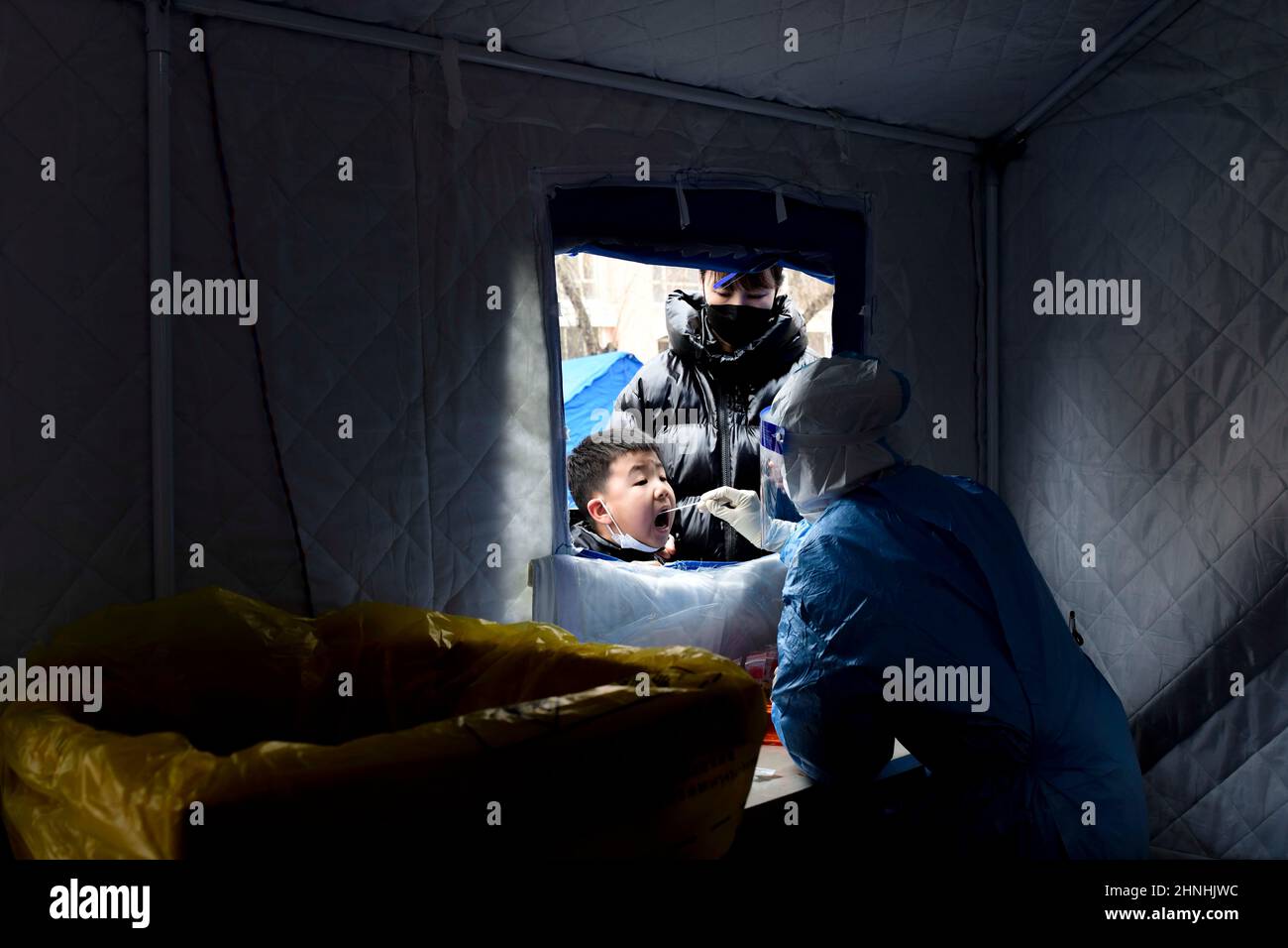 HOHHOT, CHINA - FEBRUARY 17, 2022 - Medical staff take nucleic acid