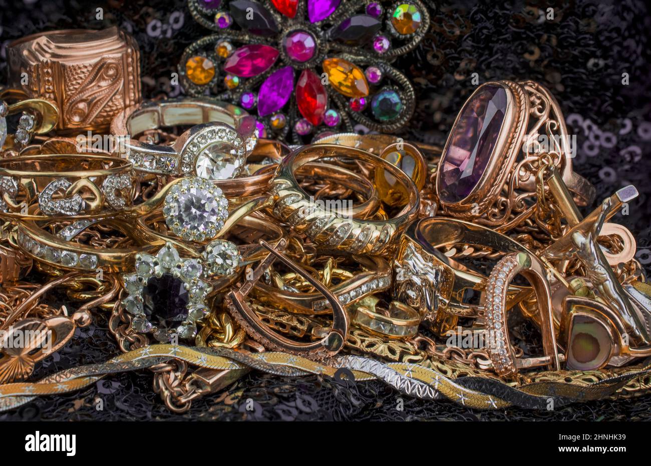 pile of gold on black background Stock Photo - Alamy