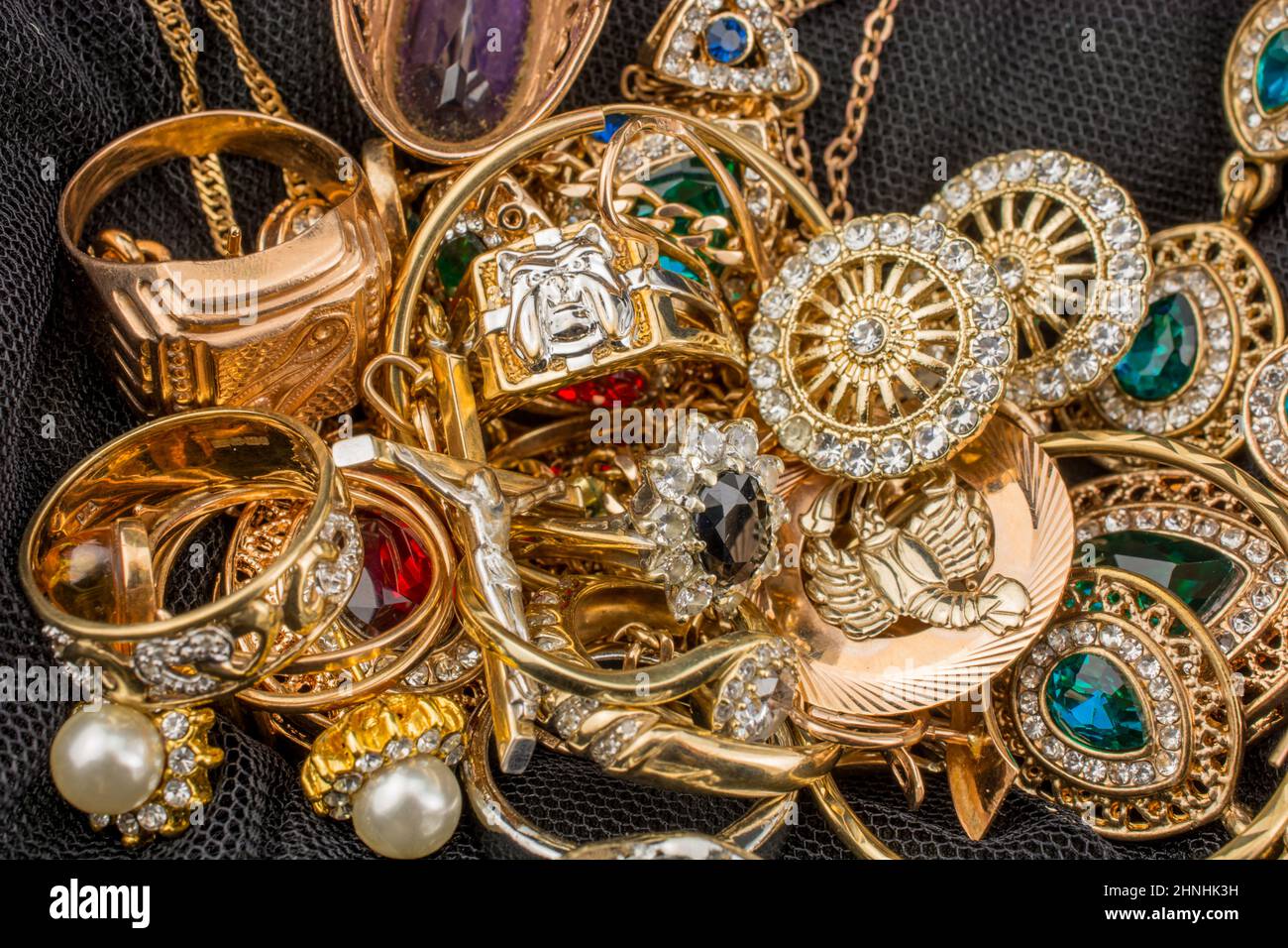 pile of gold on black background Stock Photo - Alamy