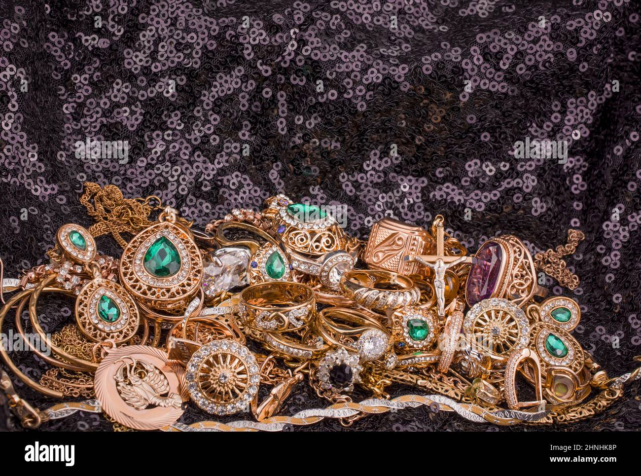 pile of gold on black background Stock Photo - Alamy