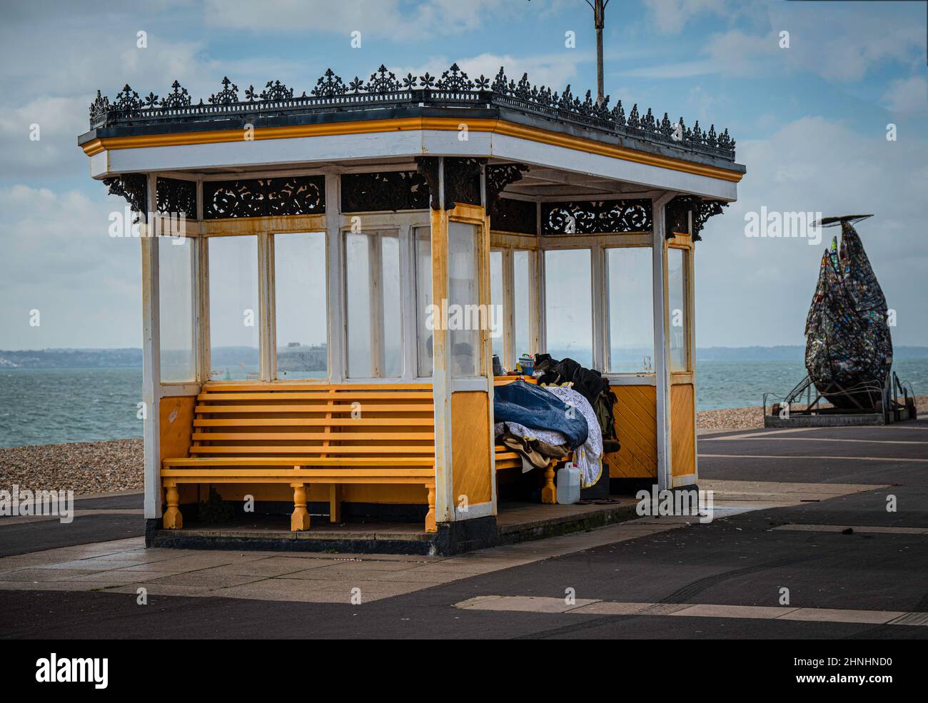 The blankets and other posessions of someone sleeping rough along Southsea seafront. Stock Photo