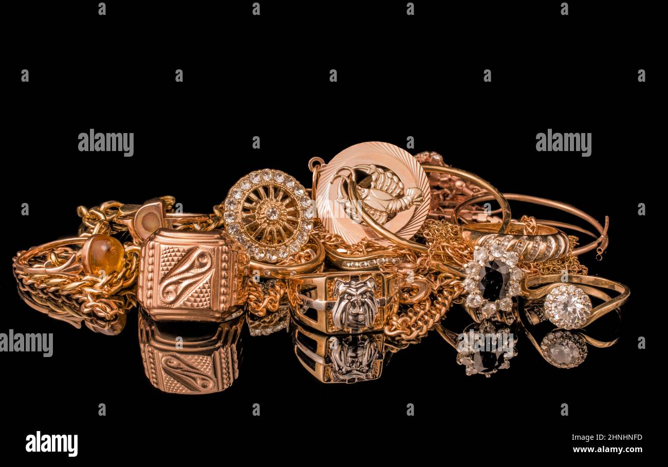 pile of gold on black background Stock Photo - Alamy
