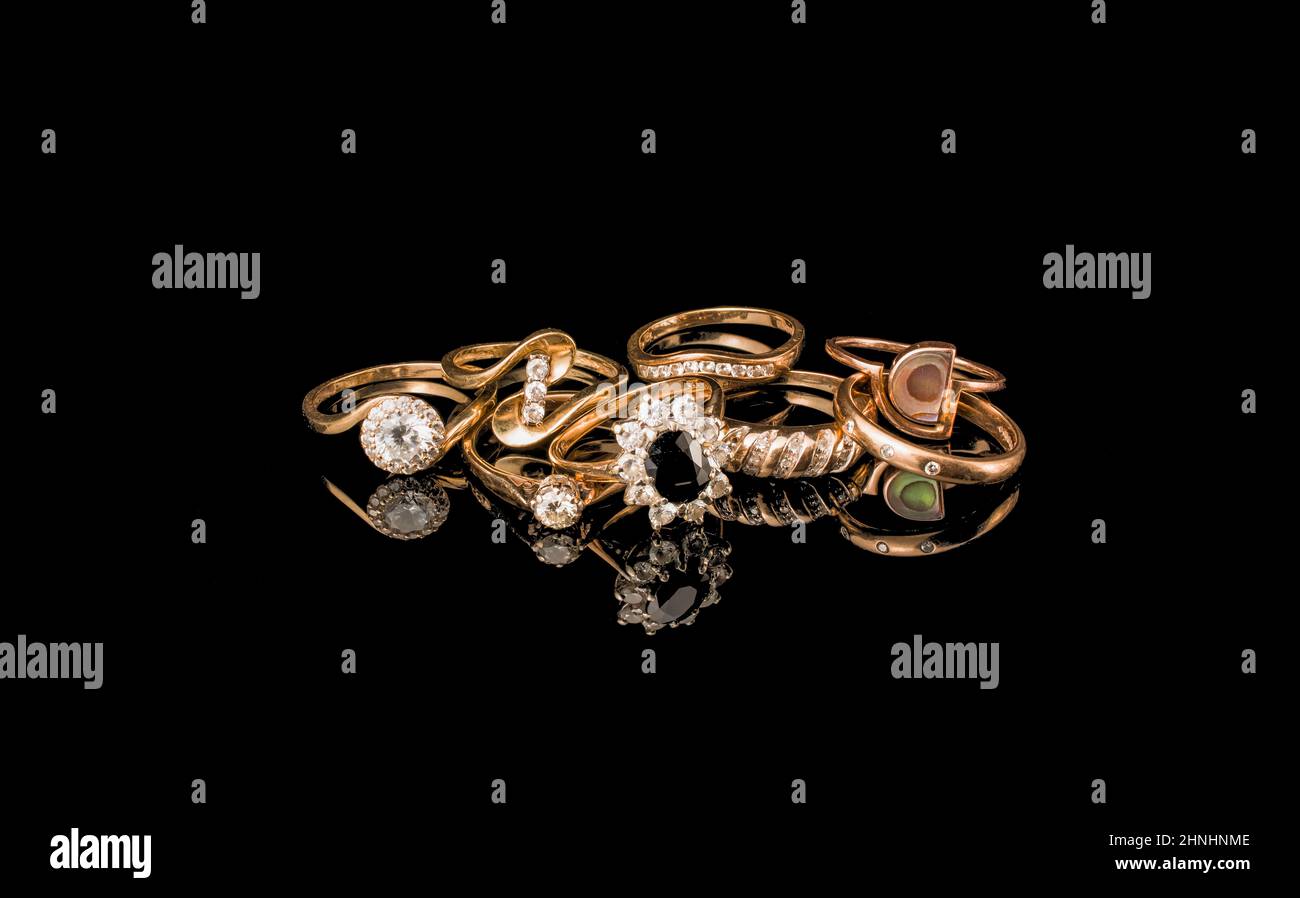 pile of gold on black background Stock Photo - Alamy