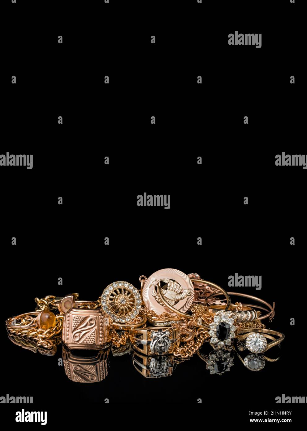 pile of gold on black background Stock Photo - Alamy