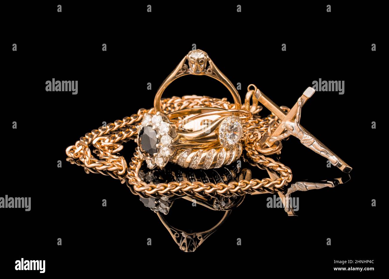 pile of gold on black background Stock Photo - Alamy