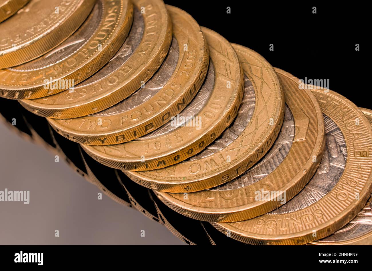 pile of gold on black background Stock Photo - Alamy