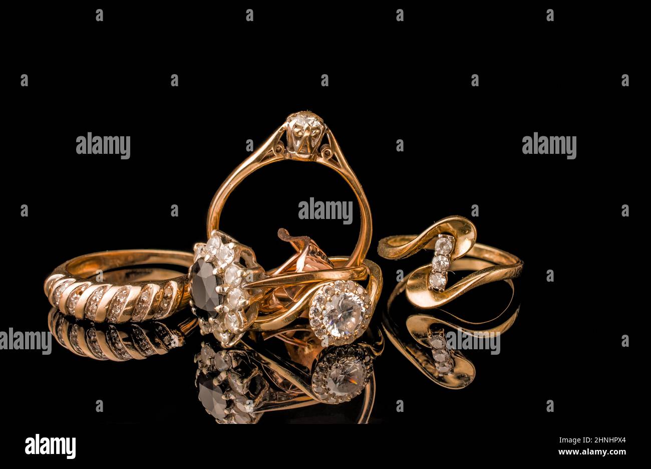 pile of gold on black background Stock Photo - Alamy