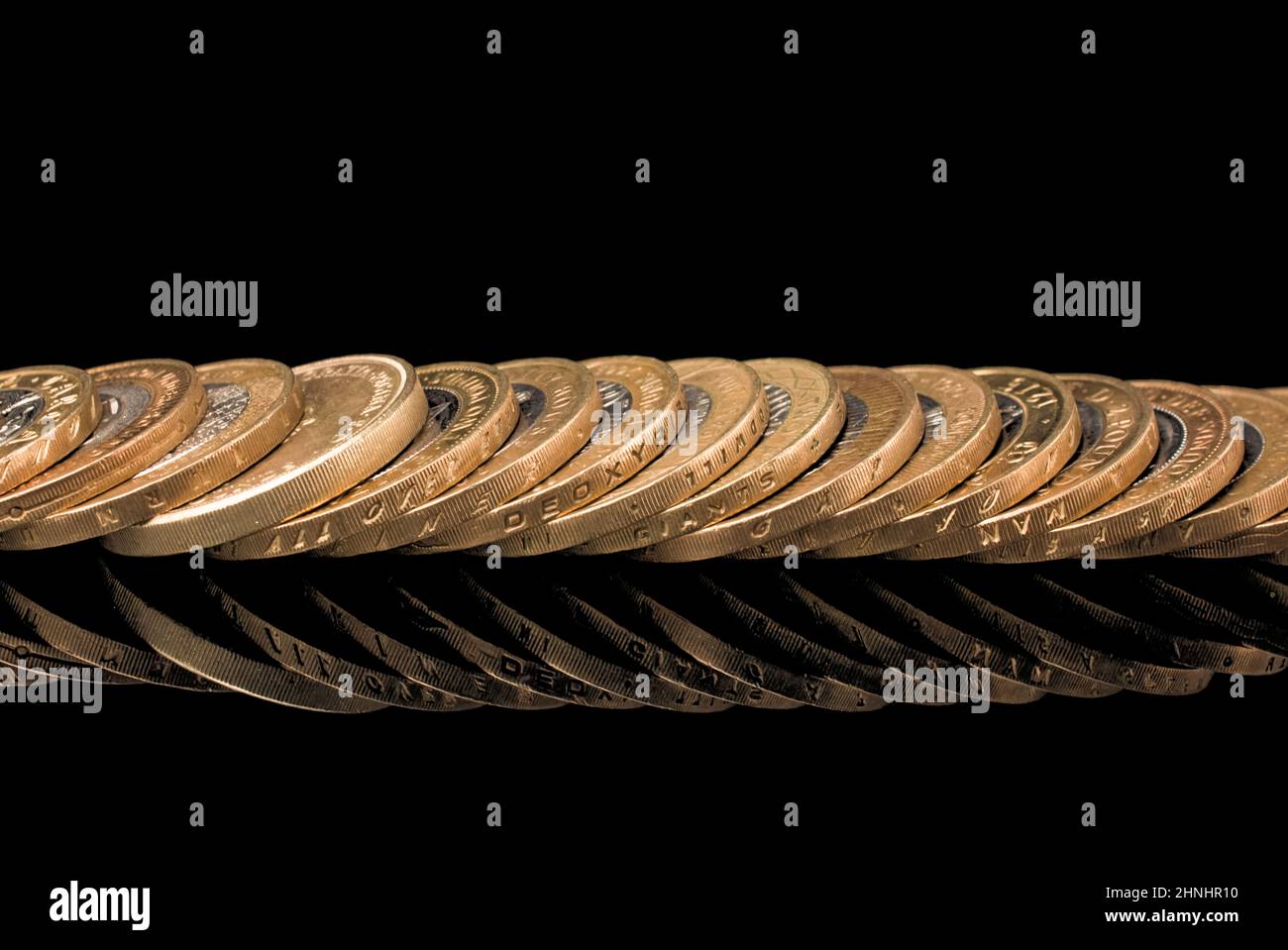 pile of gold on black background Stock Photo - Alamy