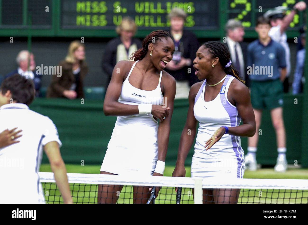 Venus and Serena Williams celebrate their win against Ai Sugiyama and Julie Halard-Decugis in the Women's doubles at Wimbledon 10th July 2000 Stock Photo