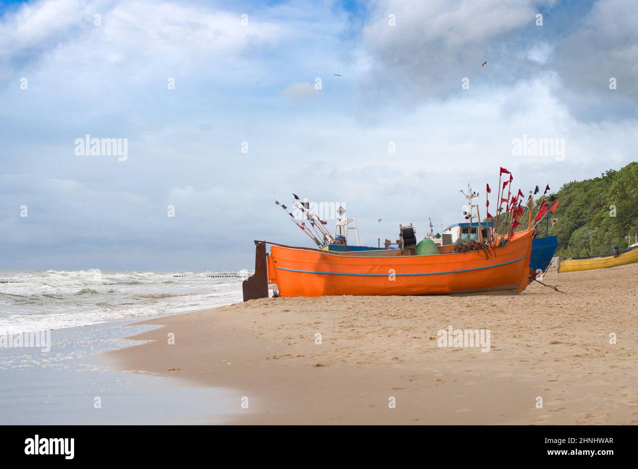 Fishing boat on the beach of the Polish Baltic coast near Rewal Stock Photo
