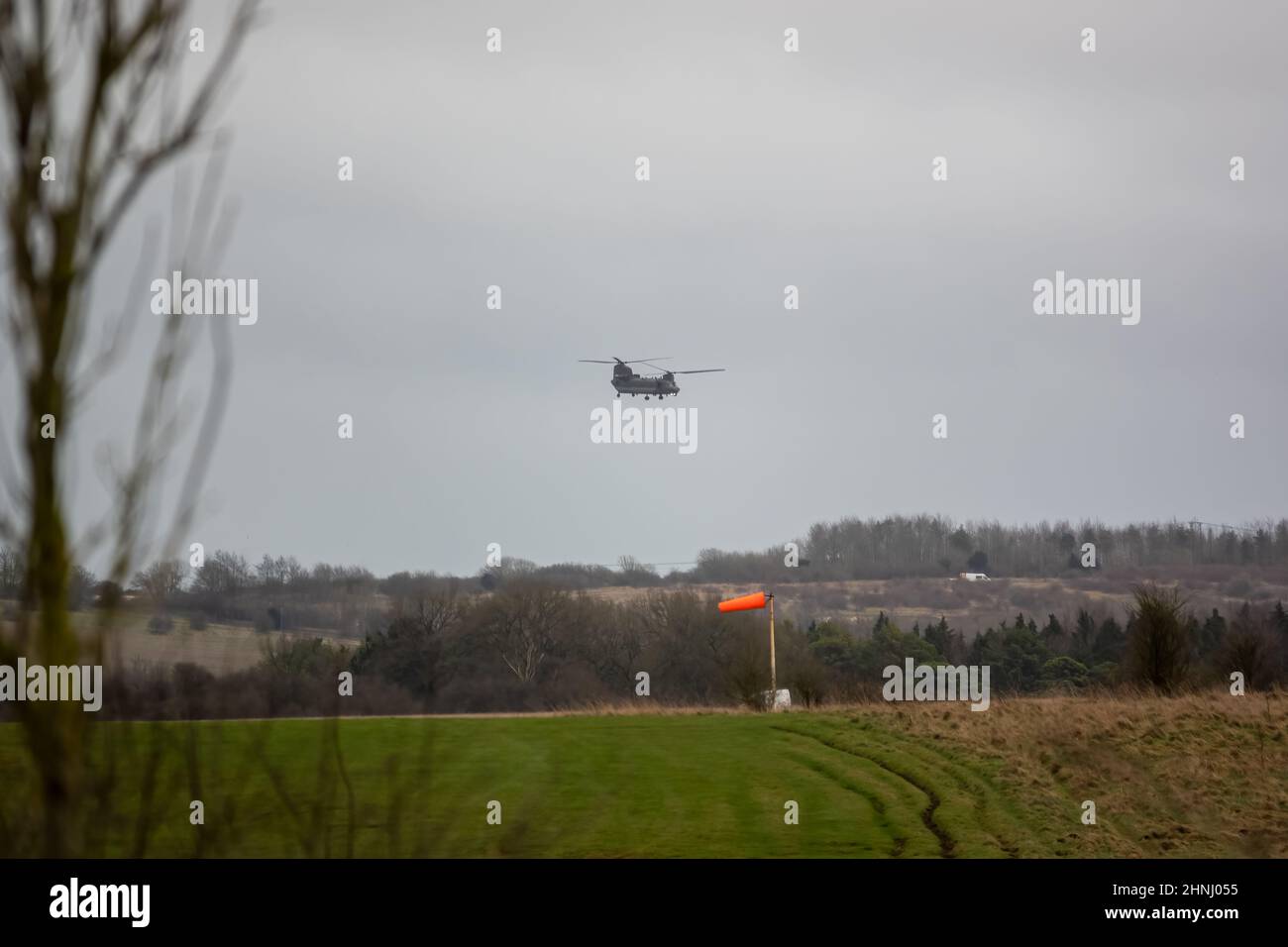 RAF Chinook tandemrotor CH47 helicopter flying fast and low in a