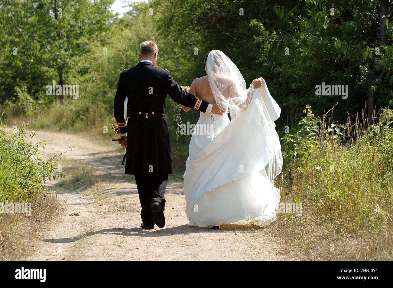 Wedding couple walking Stock Photo - Alamy