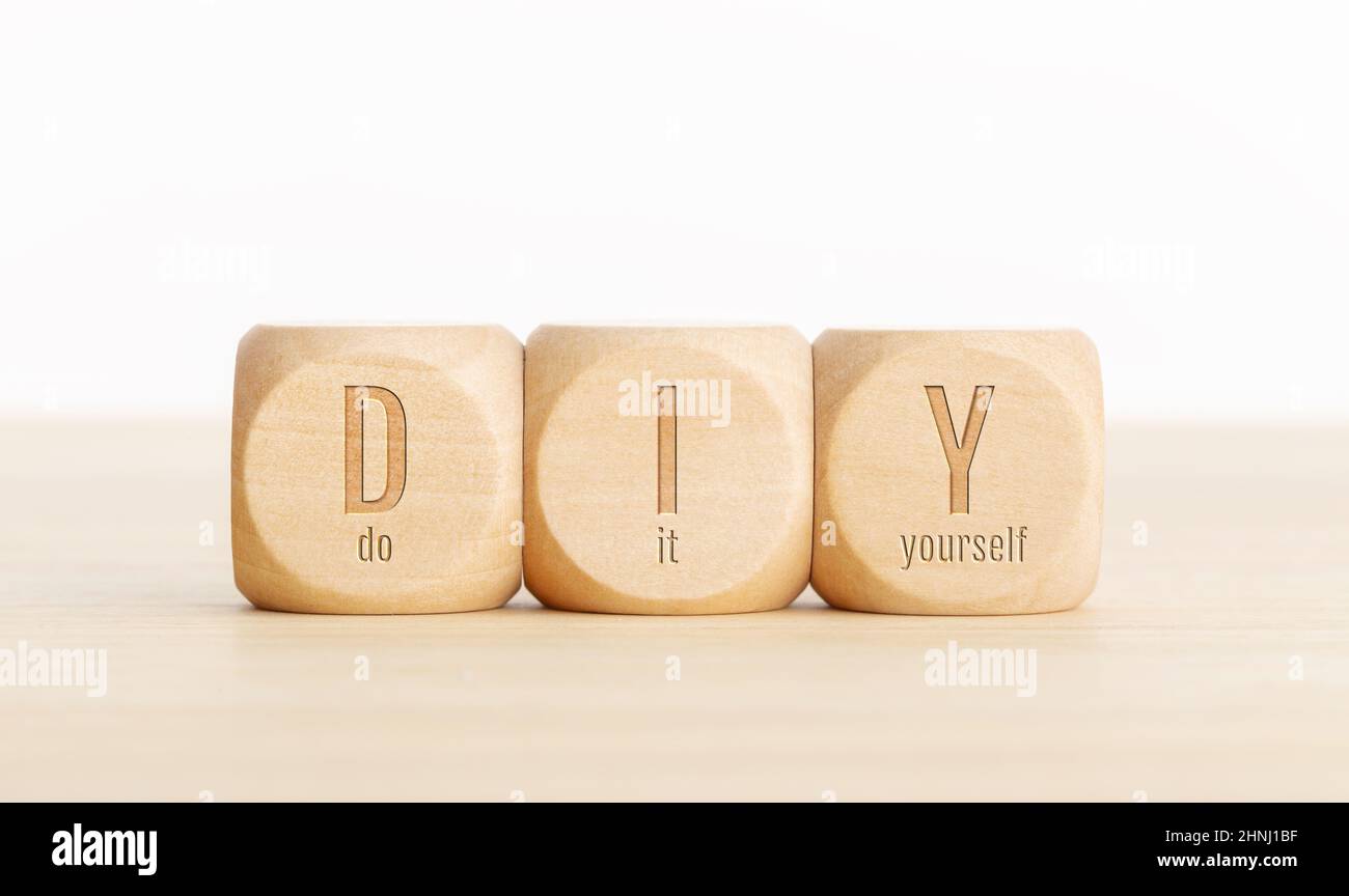 DIY word on wooden cube. Do it yourself. Copy space Stock Photo