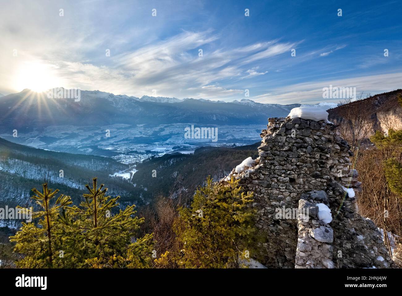 The ruins of San Pietro Castle and the sunset over Non Valley. Ton, Trento province, Trentino Alto-Adige, Italy, Europe. Stock Photo