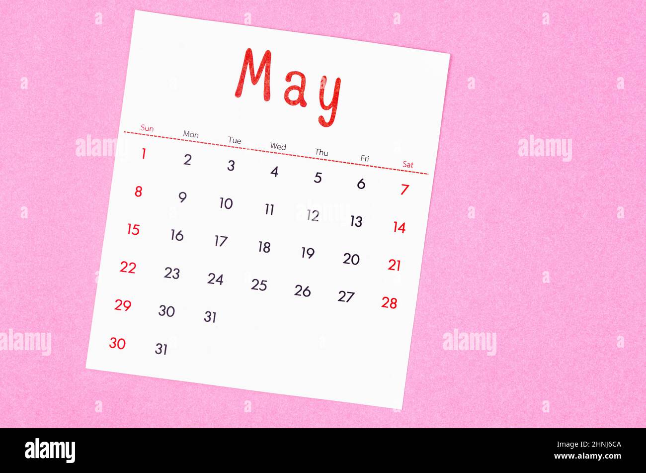 The May 2022 calendar on pink background with empty space. Stock Photo