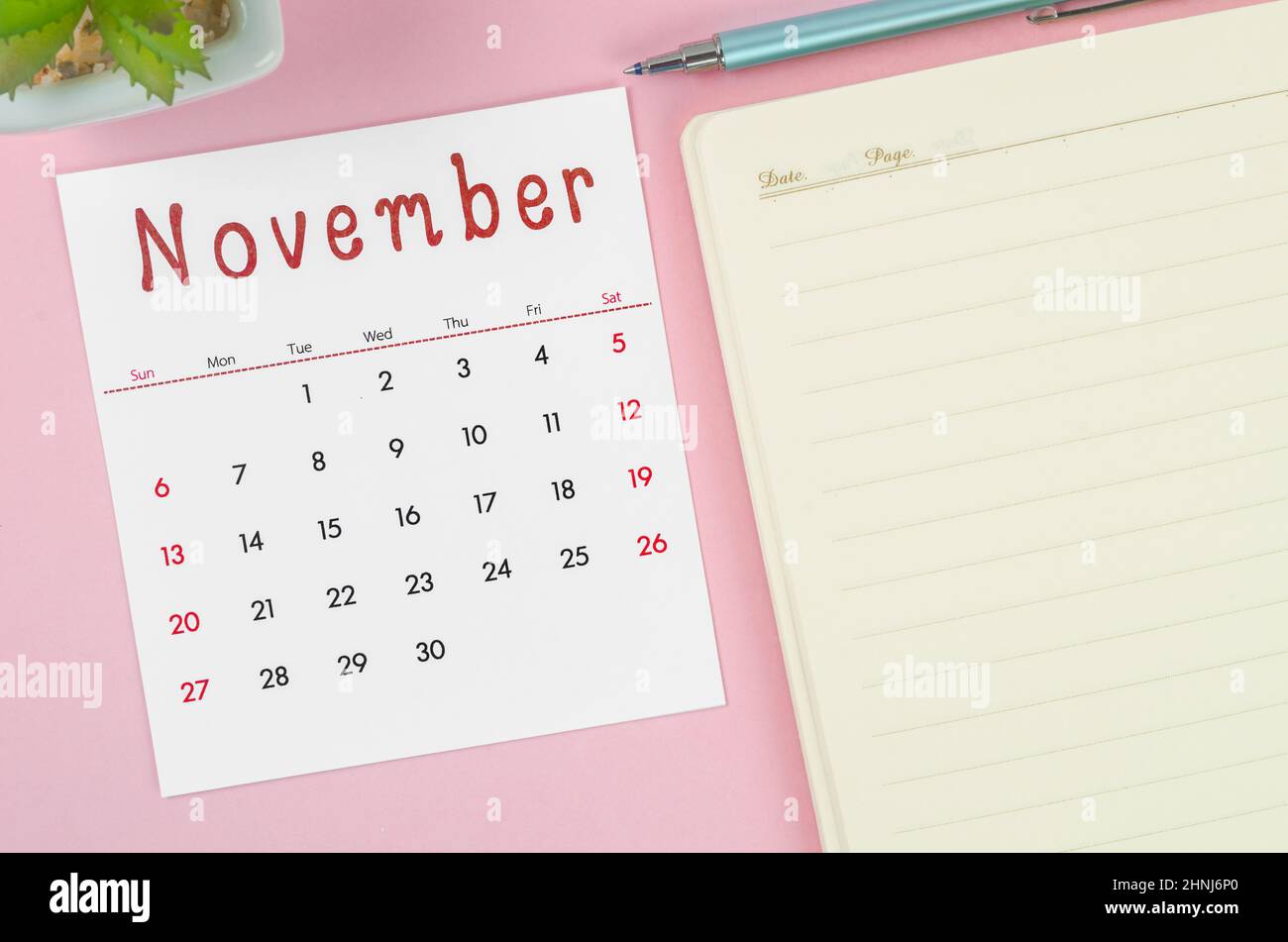 The November 2022 Desk Calendar With Plant Pot On Pink Background Stock Photo - Alamy
