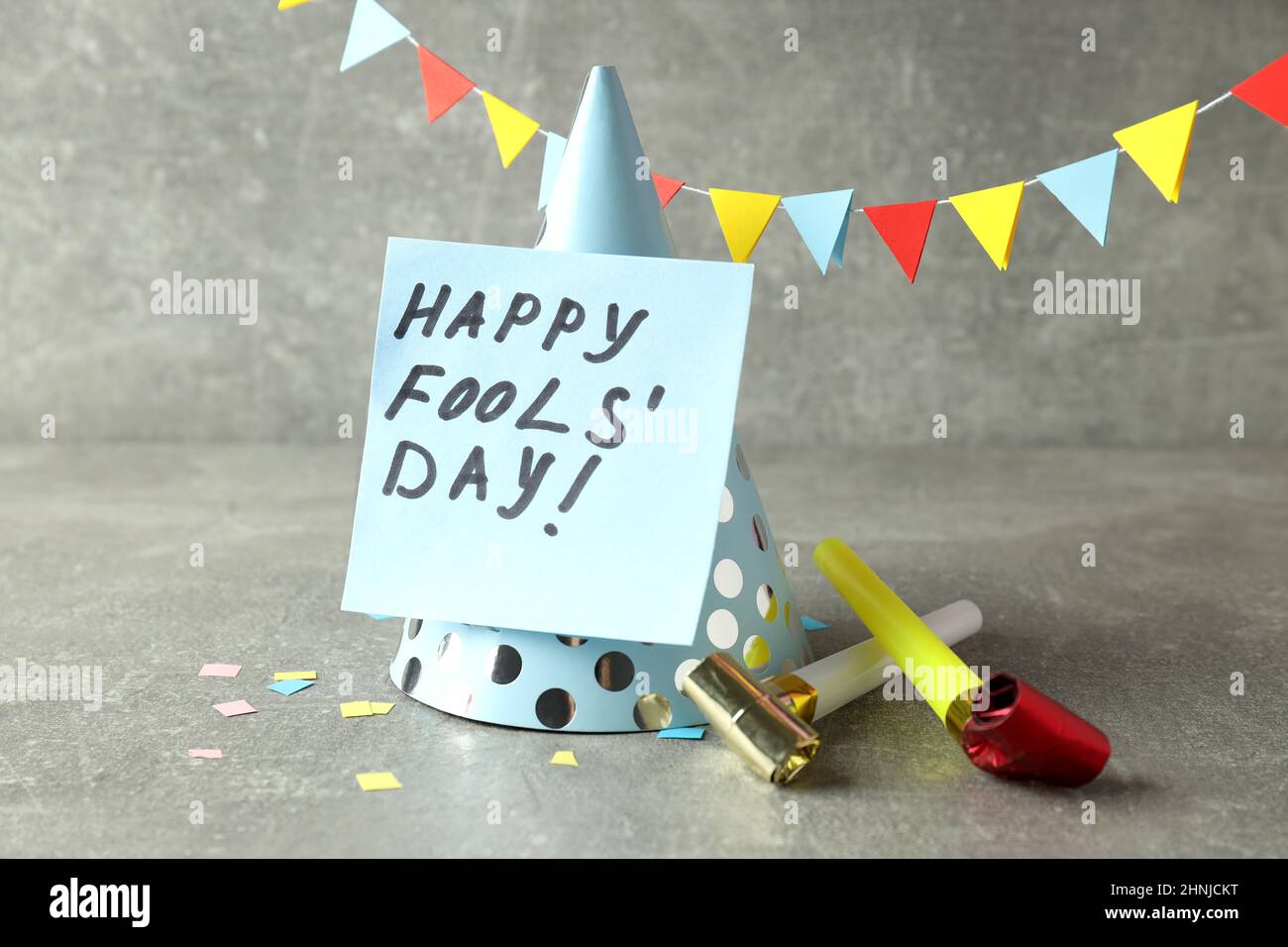 Concept of April Fool's Day on gray textured table Stock Photo - Alamy