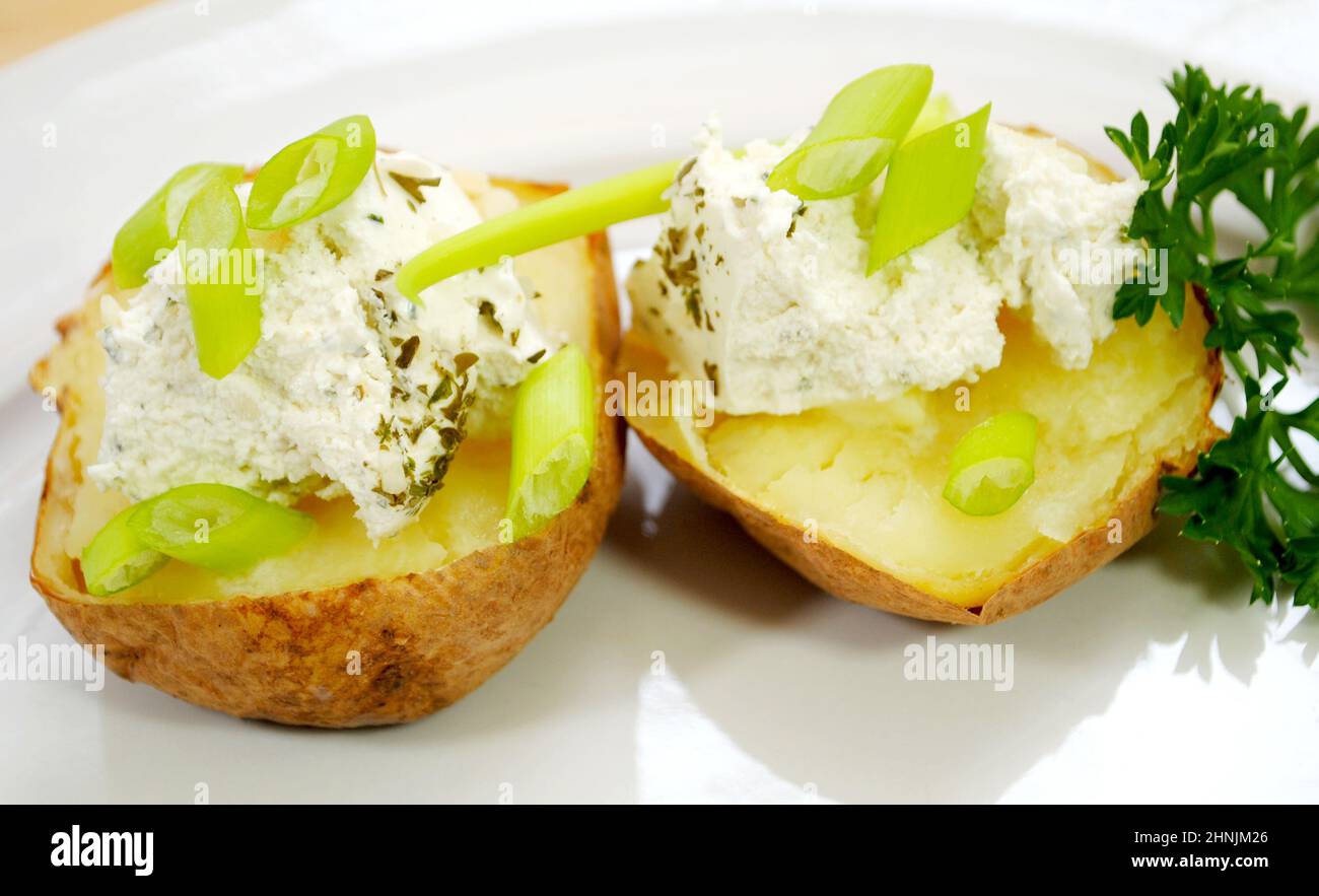 Baked Potato with Sour Cream, Scallions and Herbs Stock Photo Alamy